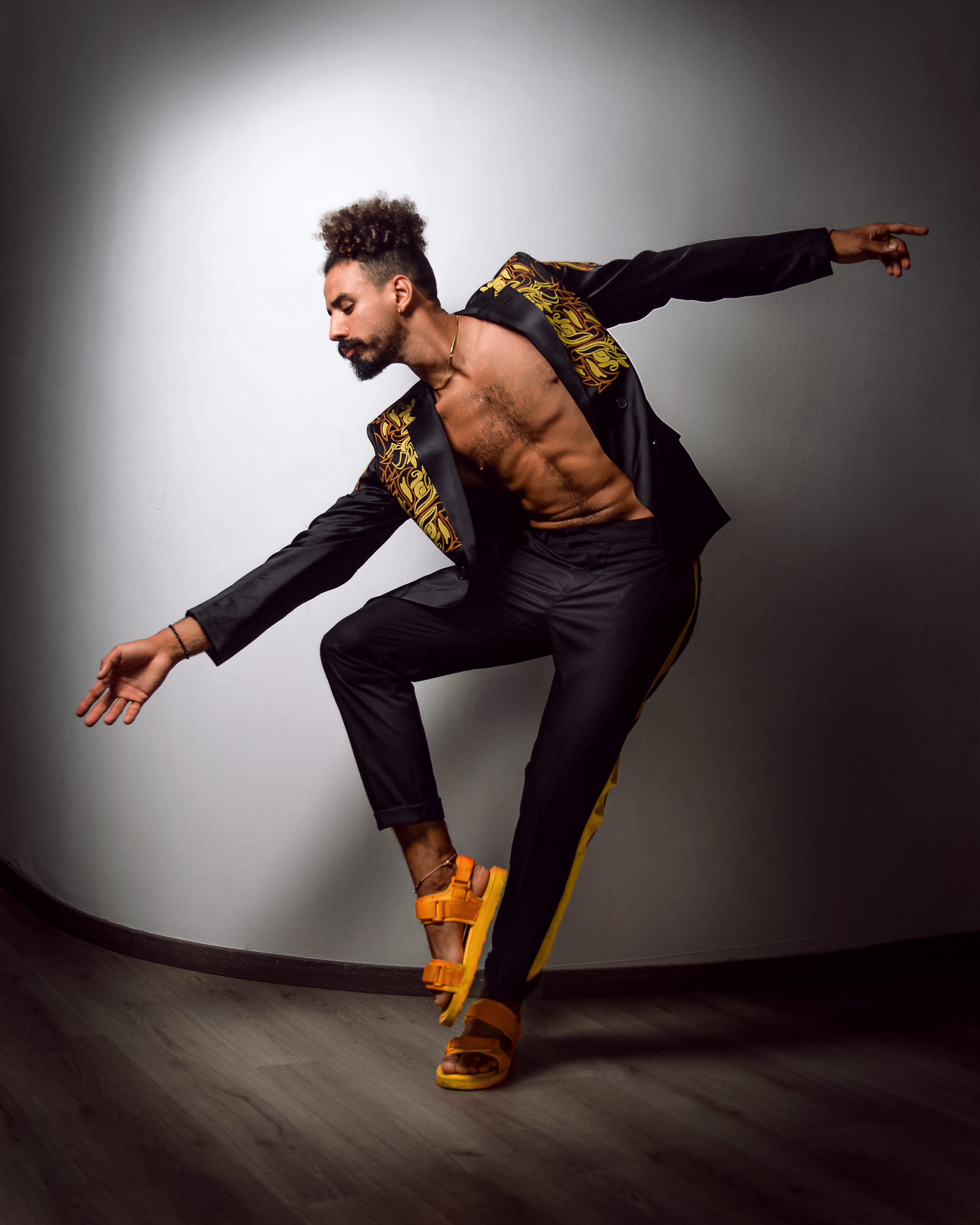 A fujifilm instant camera on a dark electric blue background.