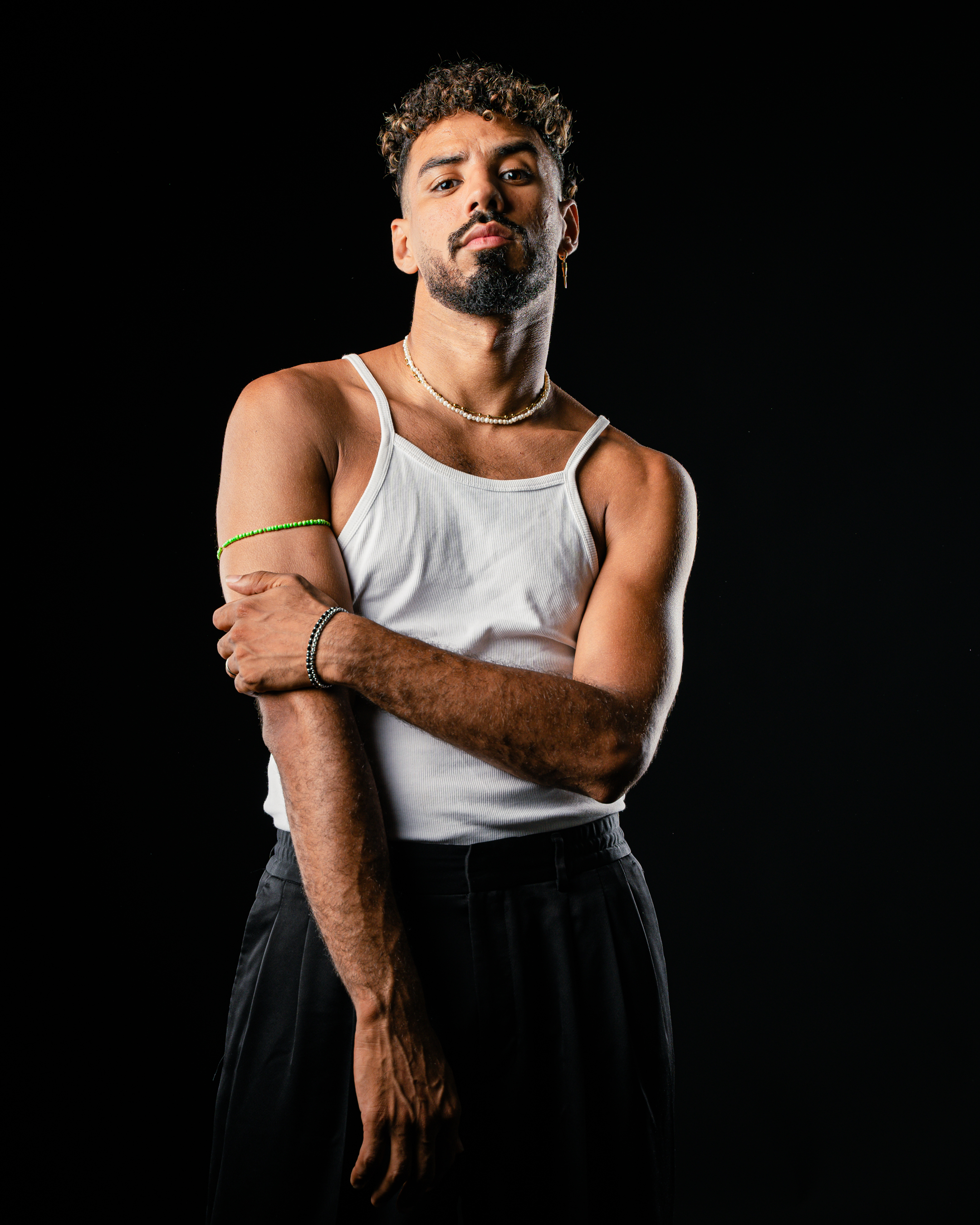 A man in a alice blue shirt with a thinking expression