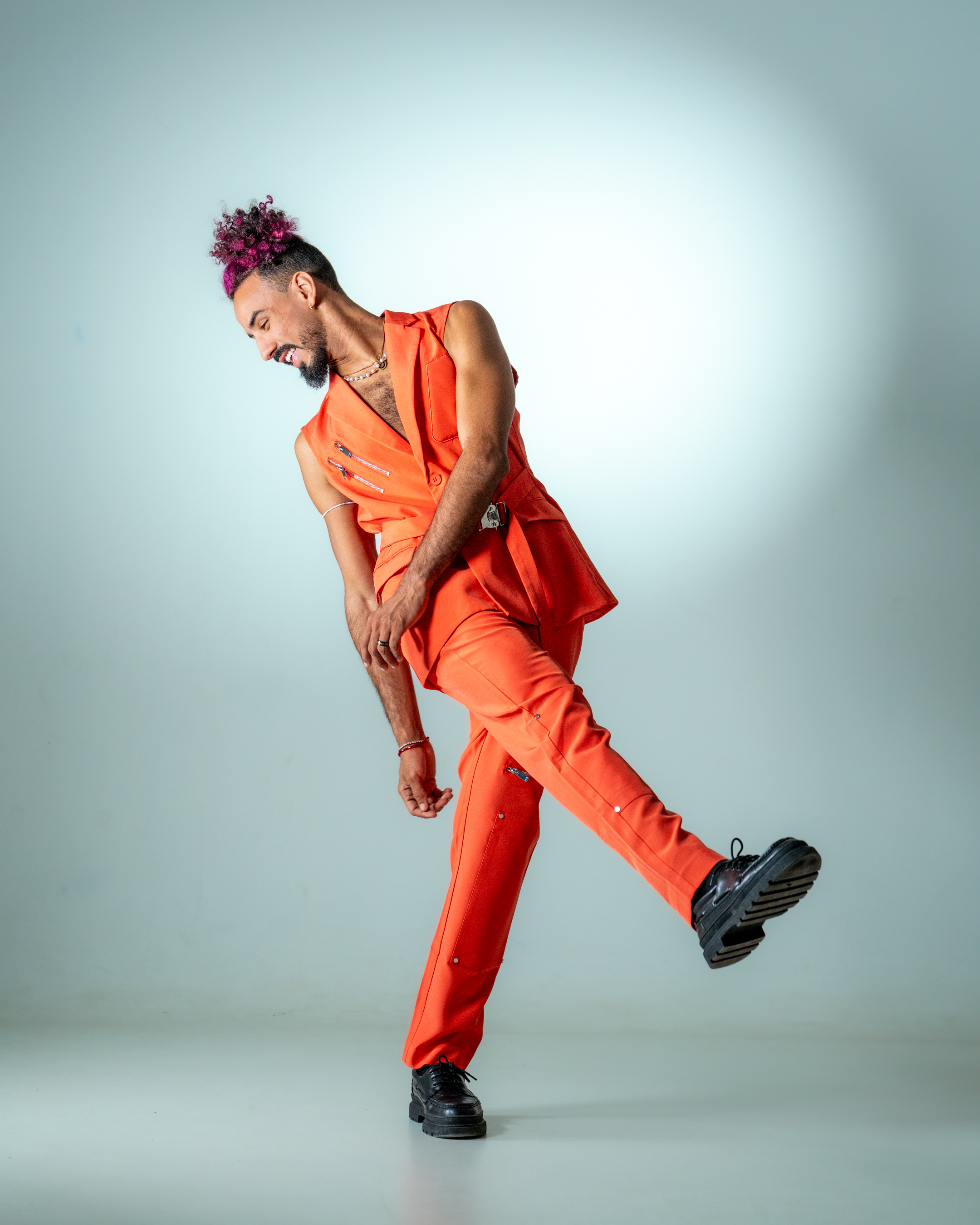 On a yellow background, a digital watch and a glass.